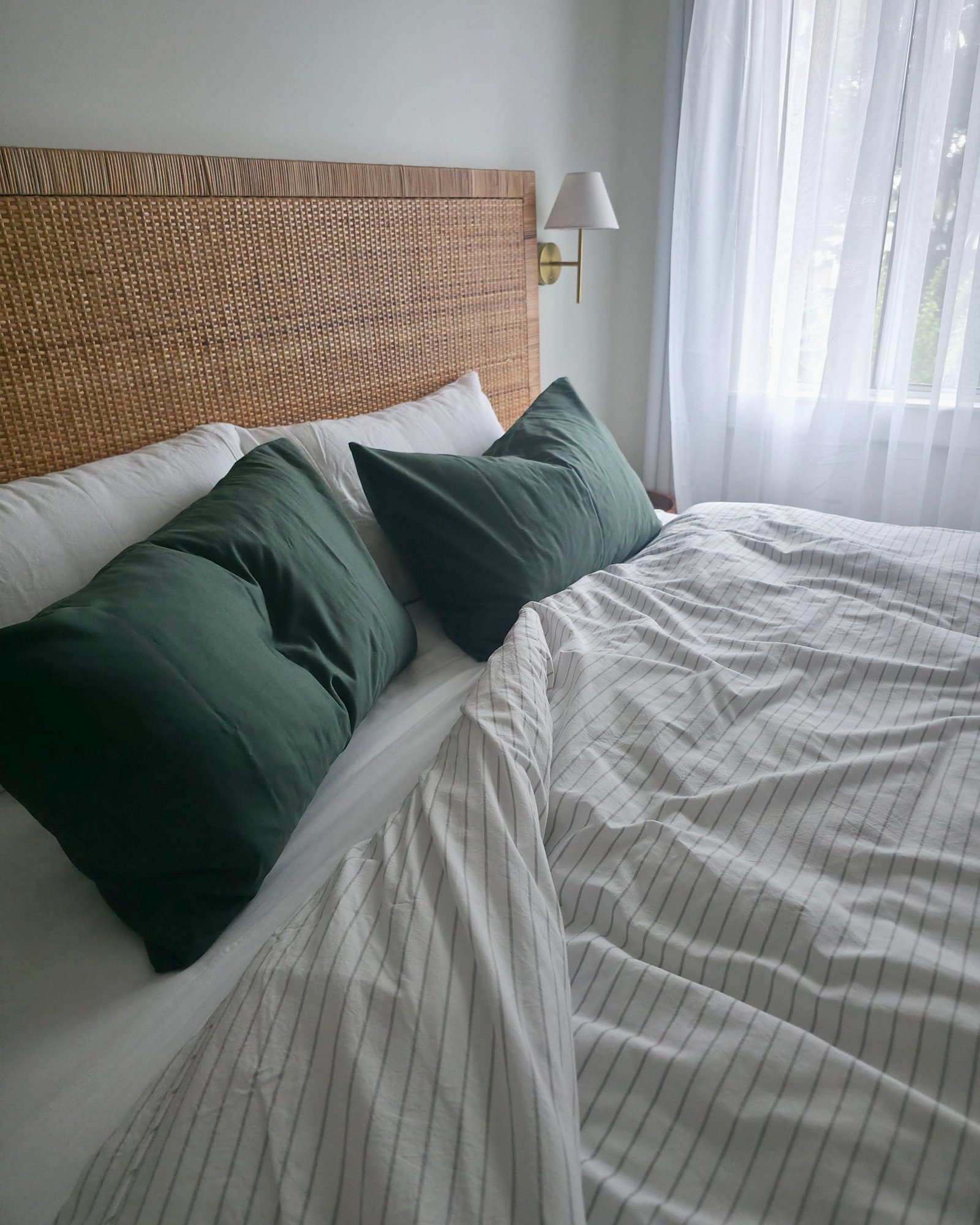 Pin stripe black cover, moss green pillowcases, waffle throw natural, angled (lifestyle)